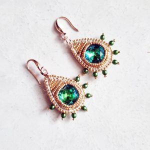 Gold drop shape earrings with emerald rivoli