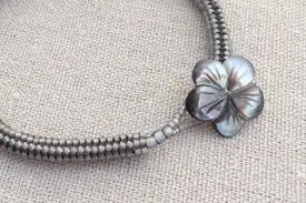 Secure clasp reinforcement in handmade glass bead jewelry